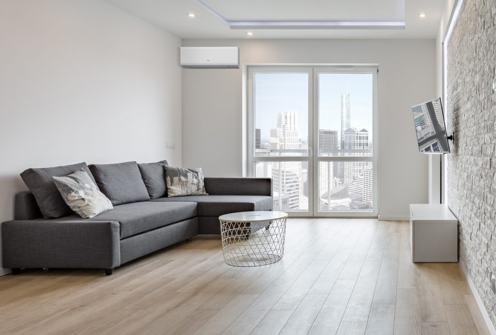 White apartment with brick wall